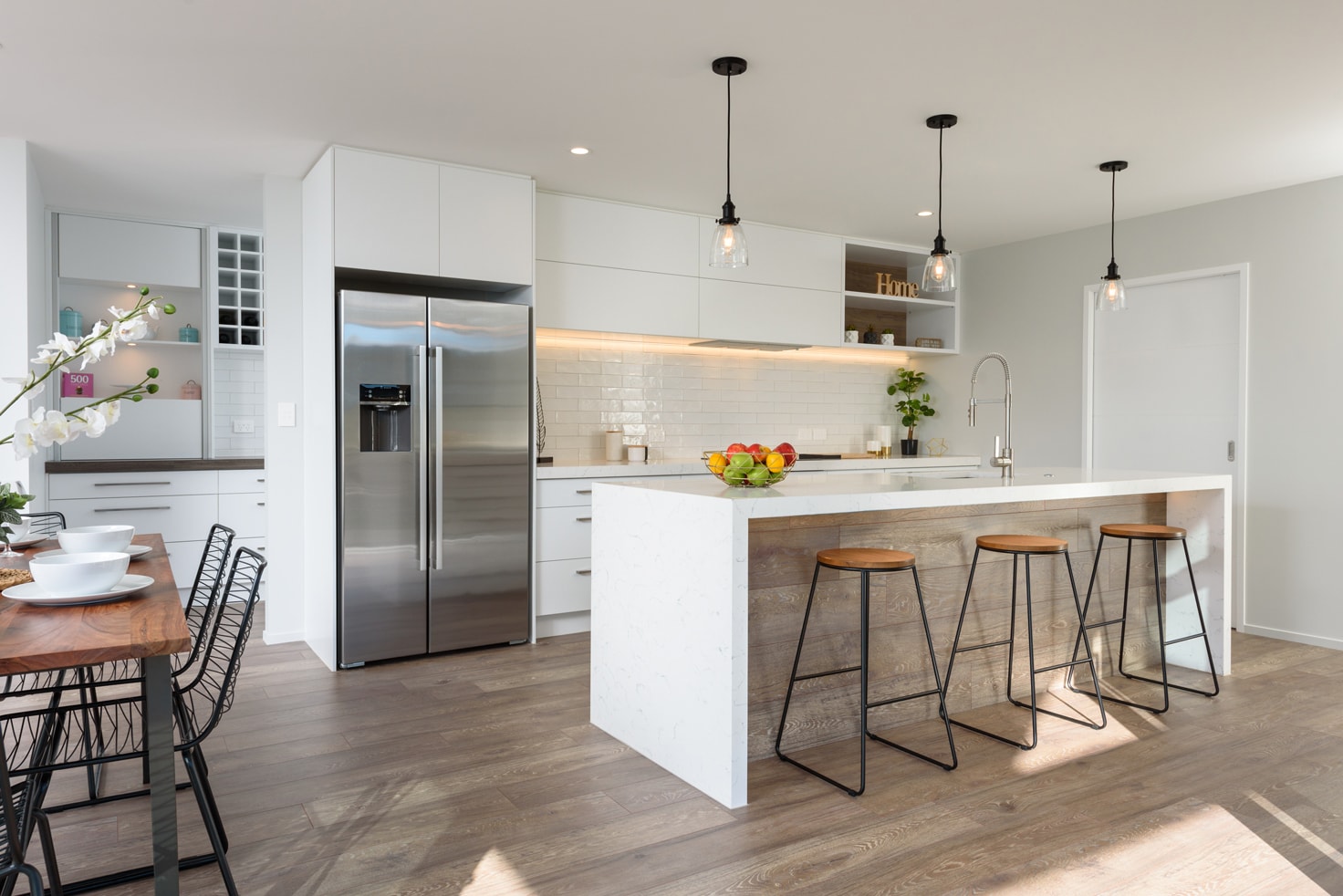 modern kitchen and with view of kitchen island and chairs