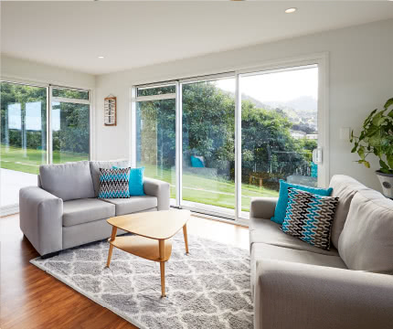 living room couches and patio doors