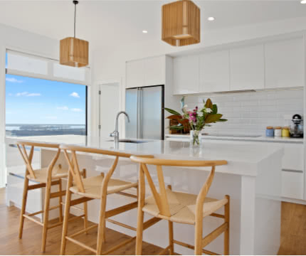 modern kitchen and with view of kitchen island and chairs